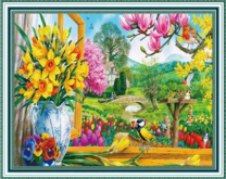 Синичка в цветущем весеннем саду